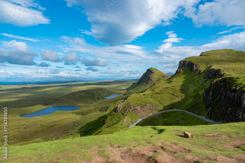 Breathtaking view of hilly landscape dotted with blue lochs on the Isle of Skye