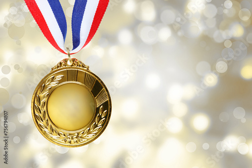 First place golden medal award in front of blurred background 