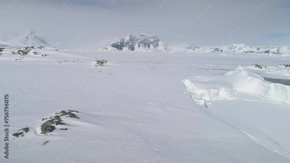 Snow Covered Antarctica Mountain Aerial View. South Pole Epic Ice Hill Landscape. Winter Frozen Ground Continent Frost Rock Majestic Drone Fly Footage Shot in 4K (UHD) Snow Covered Antarctica Mountain Aerial View. South Pole Epic Ice Hill Landscape. Winter Frozen Ground Continent Frost Rock Majestic Drone Fly Footage Shot in 4K (UHD)