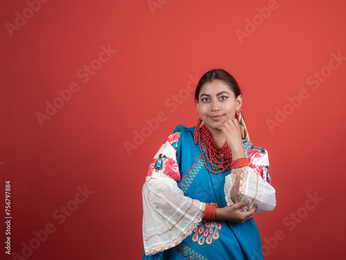 latin girl of kichwa origin happy with a red background photo