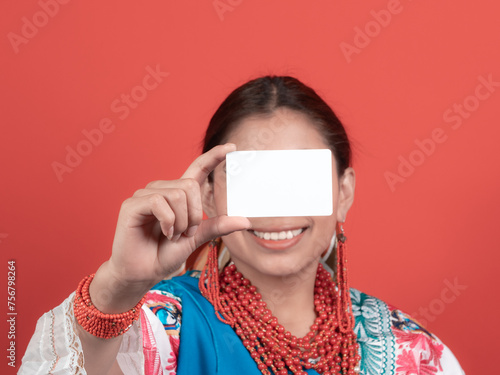ecuadorian kichwa latina girl smiling showing a credit card hiding most of her face photo