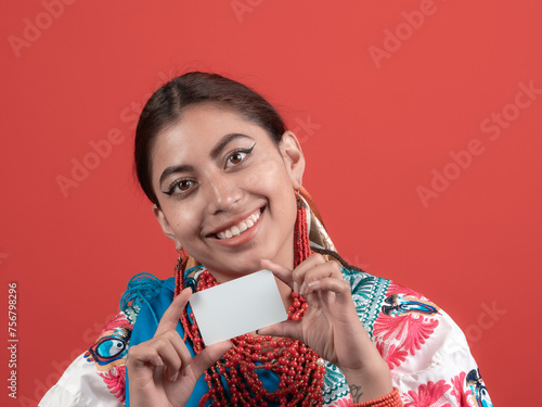 smiling kichwa latina woman happy to get a credit card photo