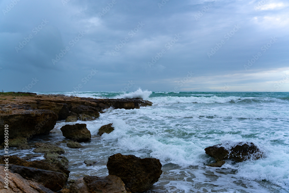 Rough sea with waves hitting the cliff