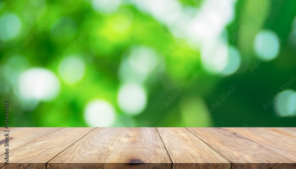 Blurred abstract green bokeh and wooden table background., for montage product display design Blurred abstract green bokeh and wooden table background., for montage product display design