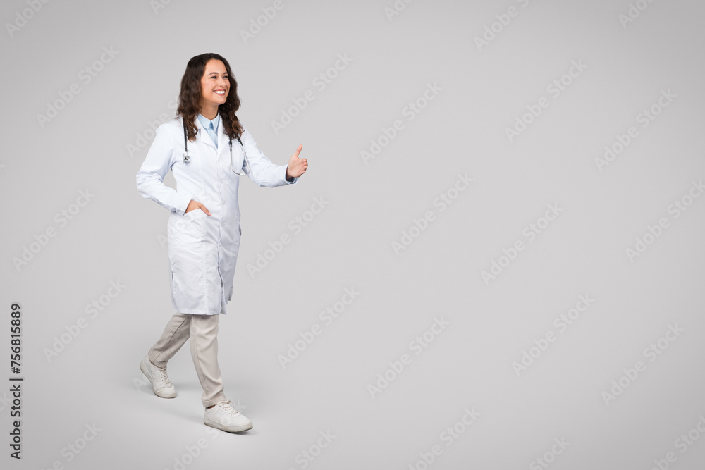 Positive european woman doctor in uniform give hand to patient to handshake on light background, free space Positive european woman doctor in uniform give hand to patient to handshake on light background, free space