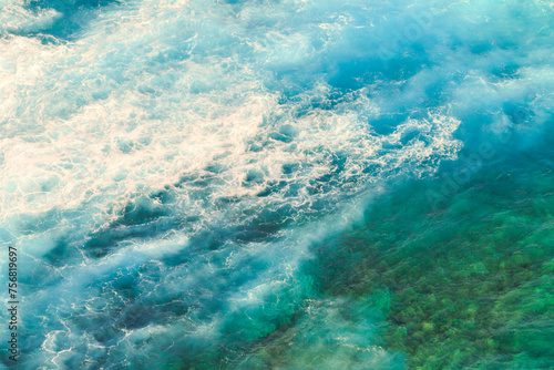 Aerial view ocean with waves background. Marine background texture of blue sea in Indian Ocean. Copy space. Horizontal shot.