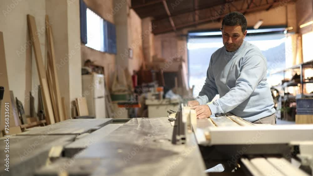 Man working wood in his carpentry shop Man working wood in his carpentry shop