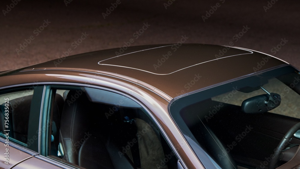 Sun roof of a brown car Sun roof of a brown car