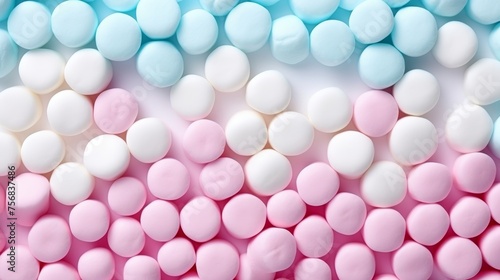 Pastel pink, white, and blue marshmallows top view background for candy shop banner