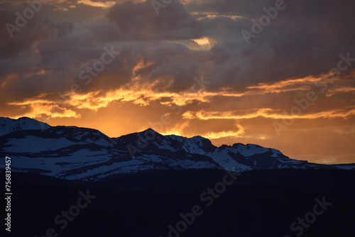 Sun Glowing Through the Clouds at Sunset Over the Rocky Mountains © Kill'N'Fuel