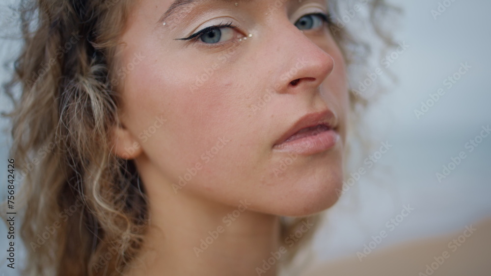 Portrait confident lady beach with shiny makeup. Woman looking camera seashore Portrait confident lady beach with shiny makeup. Woman looking camera seashore