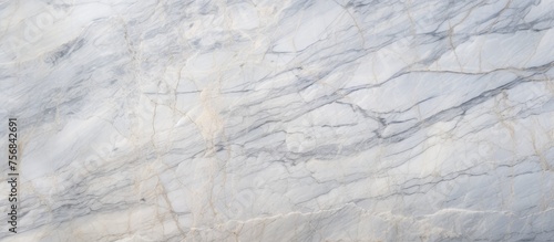 A detailed shot of a white marble flooring pattern resembling a snowy landscape in winter. The texture is as hard as hardwood, with a smooth slope similar to an automotive tire tread