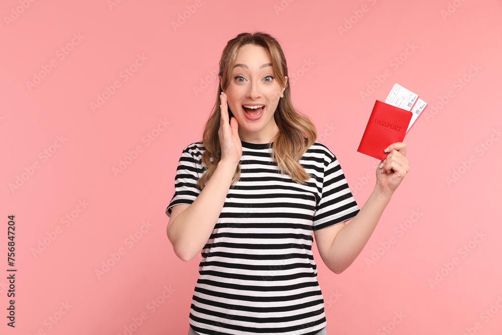 Happy young woman with passport and ticket on pink background Happy young woman with passport and ticket on pink background