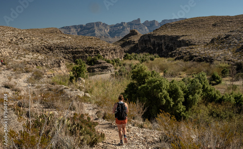 Woman Hikes Next To The Rio Grand Along The Hot Springs Trail © kellyvandellen