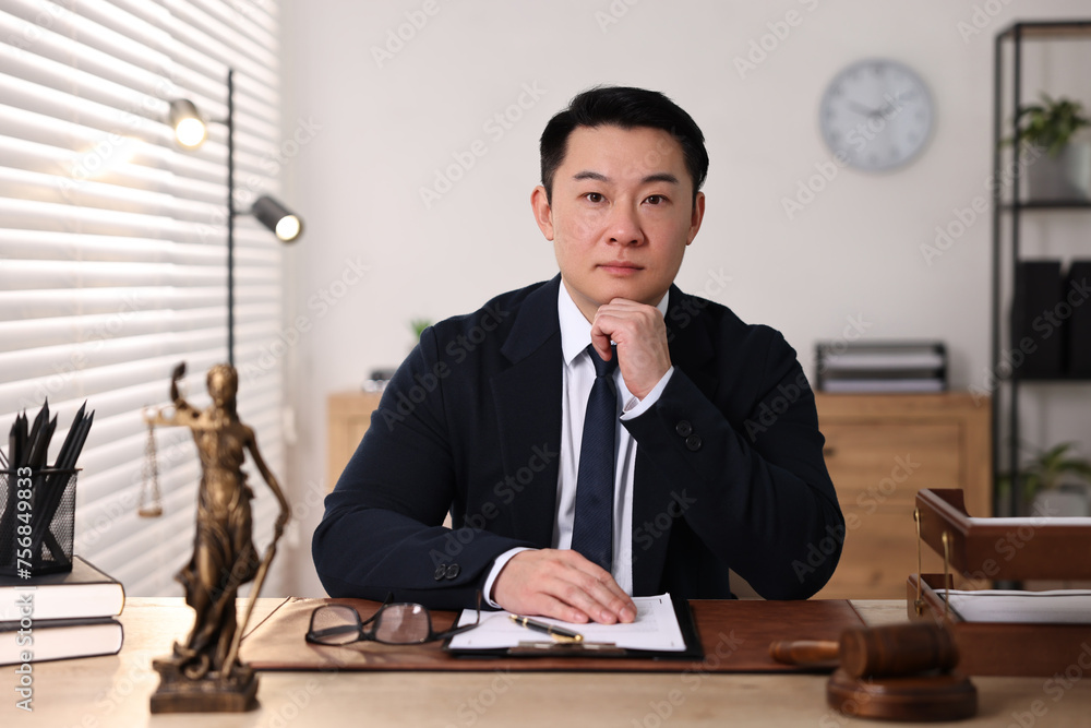 Notary working at wooden table in office Notary working at wooden table in office