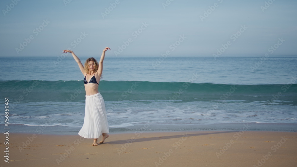 Romantic girl performing dance on beautiful sand beach. Choreographer dancing Romantic girl performing dance on beautiful sand beach. Choreographer dancing