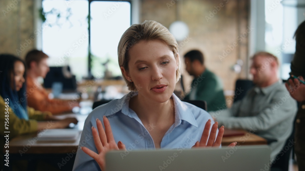 Female ceo talking online meeting sitting office coworking with team close up. Female ceo talking online meeting sitting office coworking with team close up.