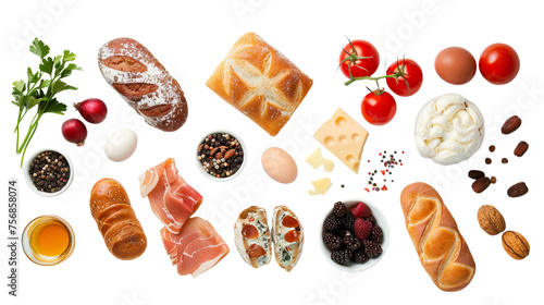 An array of breakfast food items including bread, eggs, cheese, laid out neatly against a white background photo