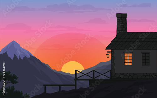 silhouette of a chalet house against a background of mountains and sunset