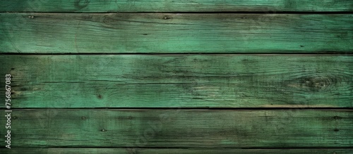 A closeup shot showcasing the intricate pattern of the hardwood flooring, with tints and shades of green highlighted by electric blue wood stain on a symmetrical wooden wall