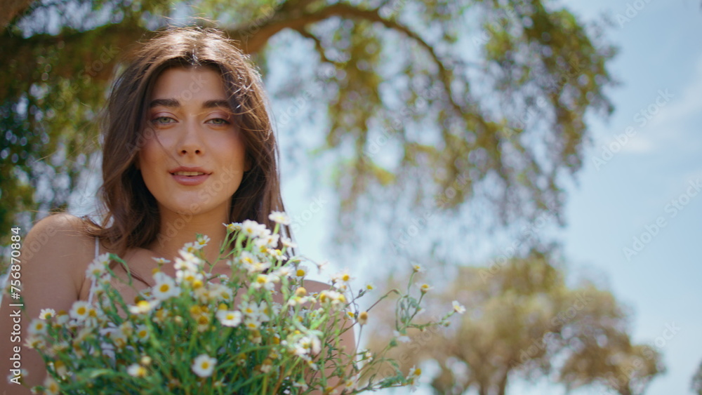Sensual girl proposing bloom at rural nature portrait. Woman enjoying flowers Sensual girl proposing bloom at rural nature portrait. Woman enjoying flowers