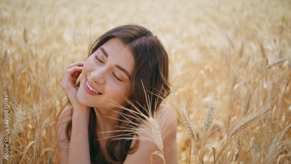 Summer model enjoying windy weather rye meadow closeup. Satisfied woman resting Summer model enjoying windy weather rye meadow closeup. Satisfied woman resting
