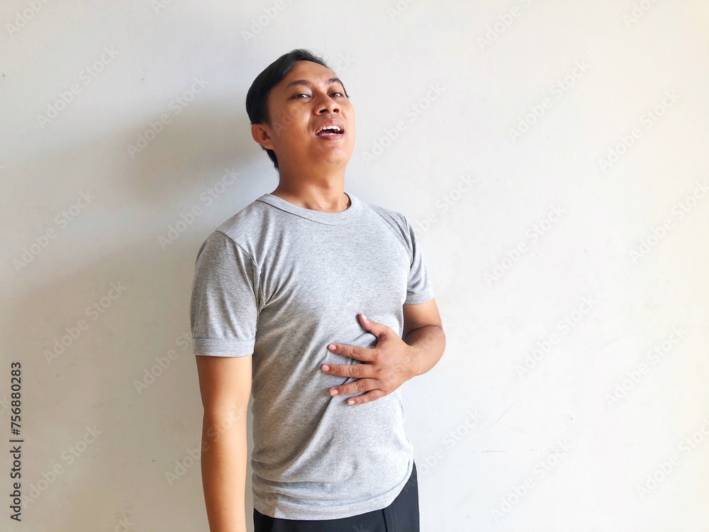 man holding stomach in pain