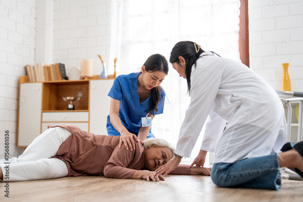 Asian caregiver help senior female from falling on the ground at home. Asian caregiver help senior female from falling on the ground at home.