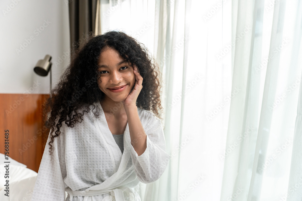 Portrait of Caucasian young girl in pajamas smile and look at camera. 