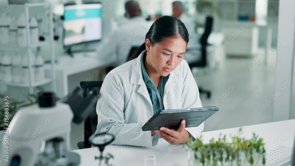 Scientist, tablet or online research in laboratory for biotechnology or working on development of innovation. Medical, asian woman or touchscreen for chemistry on internet or sustainability in plants Scientist, tablet or online research in laboratory for biotechnology or working on development of innovation. Medical, asian woman or touchscreen for chemistry on internet or sustainability in plants