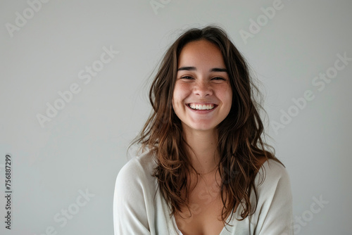 Beautiful young woman smiling portrait on white background isolated on gray for stock photo