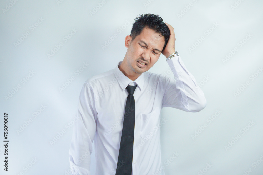 Adult Asian man got painful headache gesture Adult Asian man got painful headache gesture