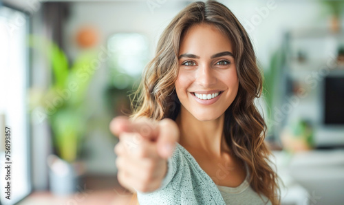 Free Download A woman with long hair is smiling and pointing to the camera - GFXLoad