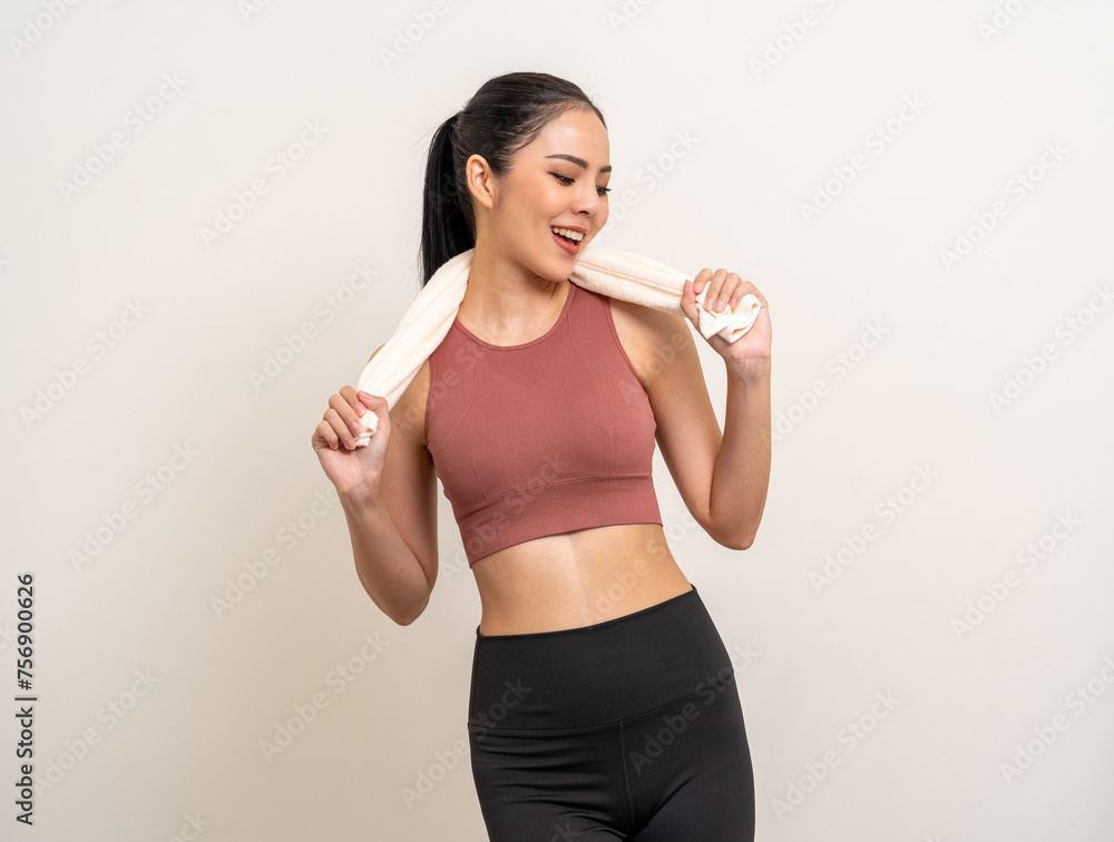 Young beautiful smiling asian woman in sportswear with towel on isolated background. Portrait happy healthy slim fit and firm latin attractive sporty woman standing pose exercise workout in studio. Young beautiful smiling asian woman in sportswear with towel on isolated background. Portrait happy healthy slim fit and firm latin attractive sporty woman standing pose exercise workout in studio.