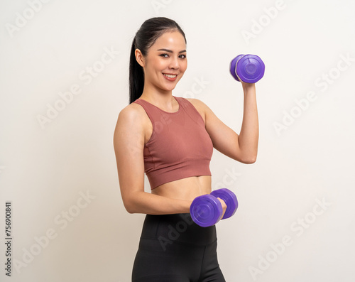 Young beautiful asian woman with sportswear exercises workout with dumbbells on isolated white background. Portrait happy healthy slim fit and firm latin attractive sporty woman weight training
