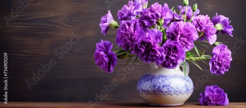 A purple flowerfilled vase rests on a wooden table, adding a pop of color and nature to the rooms decor