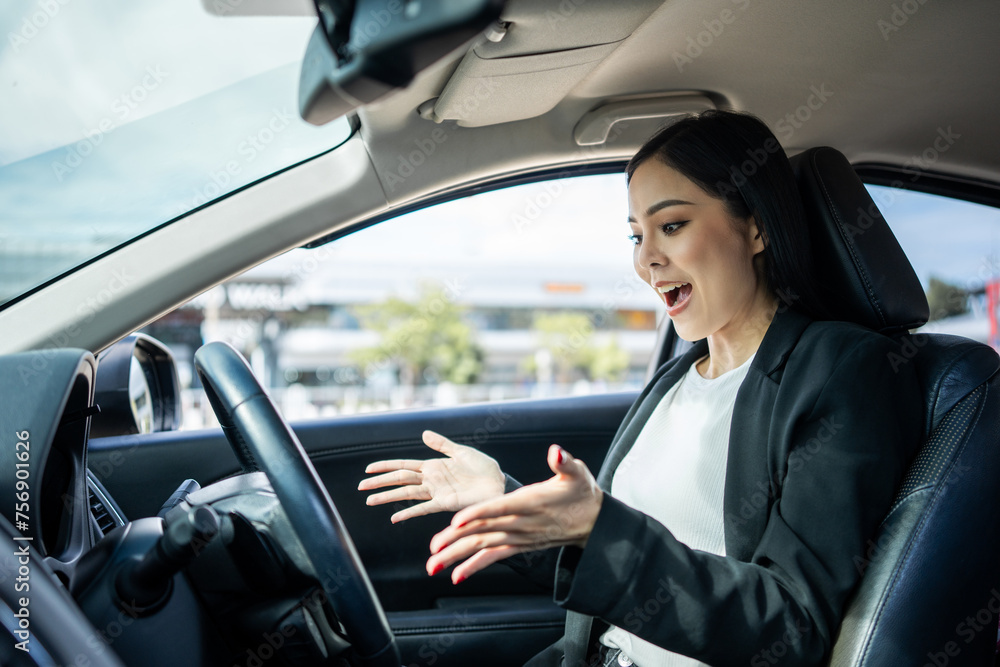 Young beautiful asian business women getting new car Very surprised happy and excited. Smiling female driving vehicle on the road on a bright day with sun light. Business woman buying driving new car