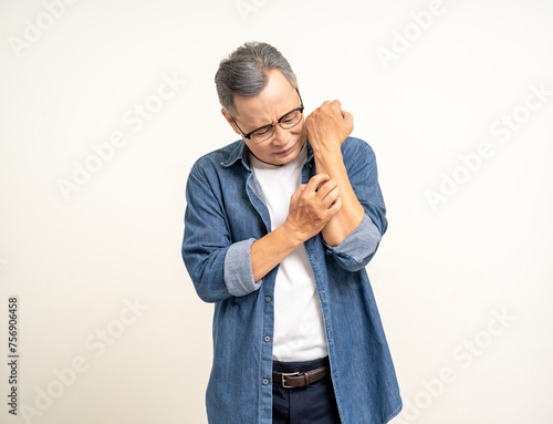 Old man senior have skin problems he felt irritation on his skin. Skin infection itching red rash scratching with hands. Unwell unhealthy Mature man standing on isolated background