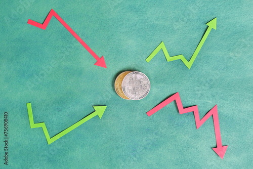Obraz na płótnie Composition of Bitcoin and upward green and downward red arrow. Cryptocurrency trading and volatility concept. w salonie