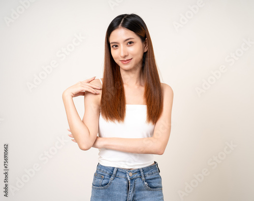 Beautiful smiling happy young asian woman age around 25. Charming female lady standing pose on isolated white background. Asian attractive woman people looking camera confident with backdrop.