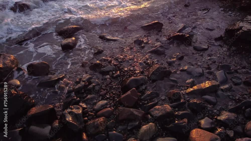 aerial of rocky beach with ocean waves crash in to coastline during sunset golden hours light aerial of rocky beach with ocean waves crash in to coastline during sunset golden hours light
