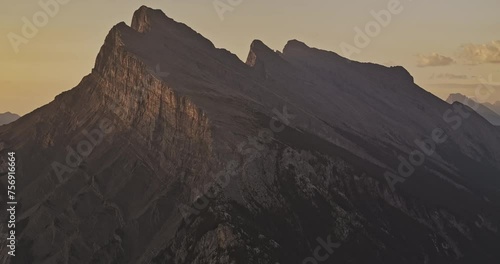 Banff AB Canada Aerial v11 drone flyover town center capturing zoomed shot of the spectacular views of Mount Rundle during golden hours of the morning sunrise - Shot with Mavic 3 Pro Cine - July 2023 photo