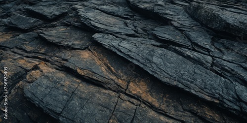 Black rock texture. Stone background. Old weathered mountain surface