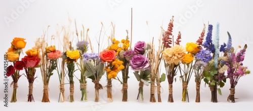 A beautiful arrangement of cut flowers, including violets, artfully displayed on a table. This floral centerpiece adds a touch of nature to any event