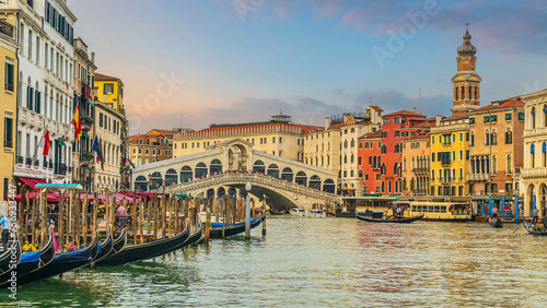 Panoramic view of famous Canal Grande with famous Rialto Bridge at sunset, Venice