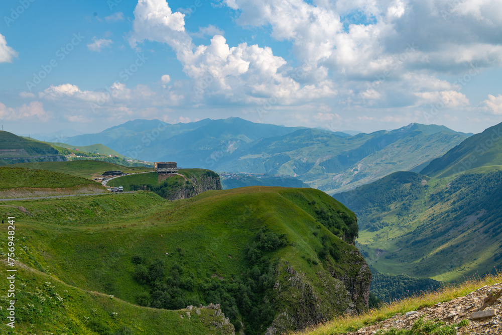 Idyllic Panorama: Green Mountains Against Blue Skies