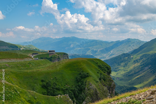 Idyllic Panorama: Green Mountains Against Blue Skies