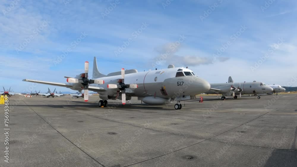 Prop-powered cargo plane sitting on a runway. Prop-powered cargo plane sitting on a runway.