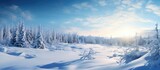 The sun breaks through the cumulus clouds over the icy forest, casting a golden glow on the snowcovered landscape and creating a stunning natural winter scene