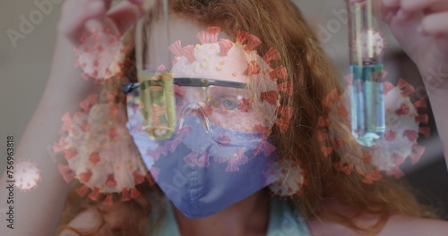 Image of covid 19 cells and schoolgirl in science class wearing face mask